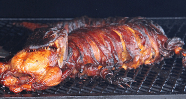 PHOTOS: Bacon Wrapped Alligator With Chicken Stuffed In Its Mouth