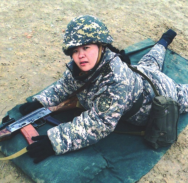 Pic shows: Tulebaev Ayzhamal Meirbekovna. Military officials in Borat’s homeland Kazakhstan have introduced a Miss Army competition to encourage more people to sign up for duty. The Kazakhstani Ministry of Defence has chosen 123 of its prettiest female soldiers and posted their photos online where viewers can vote for their faves. The photos show the women posing in three set poses: one with military uniform, one with weapons and one in civilian clothes - and they have already been seen by over 30,000. A spokesman for the MOD said: "Voting began this week and the competition is open until the 10th of May. "We’ve been flooded with views and the clear favourite at the moment is Sergeant Aigerin Karakuchukova who is in the lead with over 1,100 votes. "There is still a long way to go though and anyone could win." The spokesman revealed that the competition was also open to voters not only from Kazakhstan but also neighbouring countries Krygystan, Azerbaijan and Russia. Voter Nicephorus Bocharov, 34, said: "There are certainly some fine looking women in there, although I’m not sure it would make me want to sign up and fight. "Still, am very happy to look at them and imagine what it would be like to take them on in a full on assault." Another fan, Emil Efremov, 32, said: "I think this is a very good idea. "After the world was introduced to Borat people have the impression that everyone hear lives on a farm and sleeps with donkeys. "These photos show that Kazakh women are as beautiful as any others. "I have voted for all of them." The MOD spokesman said: "The winner will receive a cash prize and have the knowledge of knowing she is the most beautiful woman soldier in Kazakhstan. "And hopefully, she'll have the pleasure of knowing she attracted hundreds of young men to join up." (ends)       