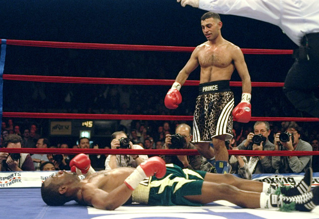 18 Dec 1997: Prince Naseem Hamed stands over Kevin Kelley during a fight at Madison Square Garden in New York City, New York. Hamed won the fight with a fourth round knockout. Mandatory Credit: Al Bello /Allsport