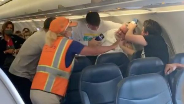 Watch Passengers Fight On A Plane After A Man Wearing A Face Shield 1566